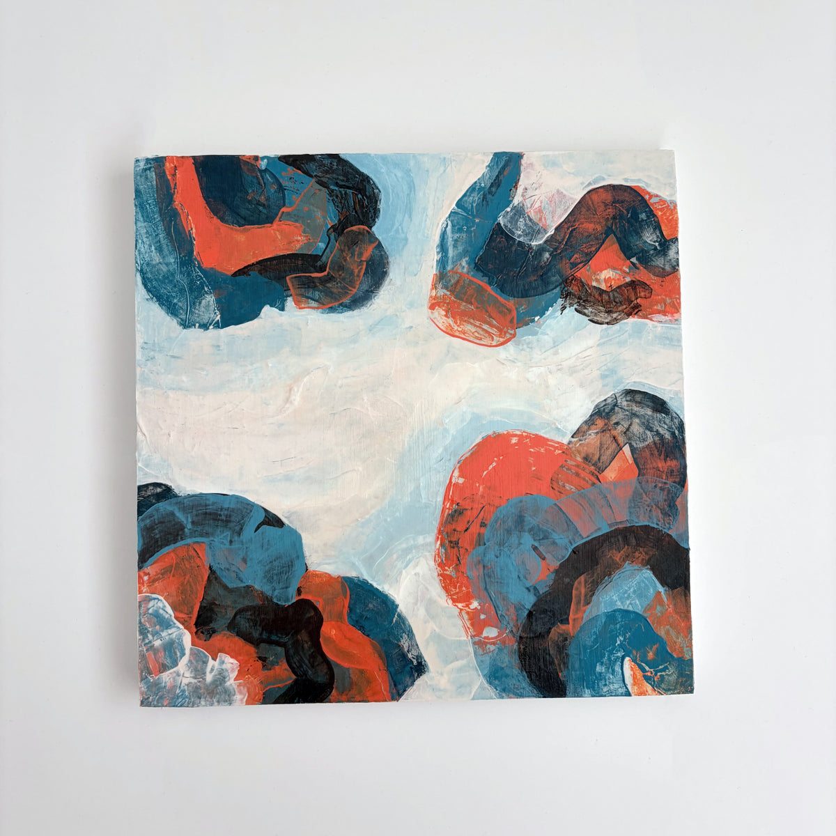 Original abstract acrylic painting "Breaking Formation" from The Sublime Horizon collection, in navy, orange and charcoal, by Rugby-based artist Olivia Miles