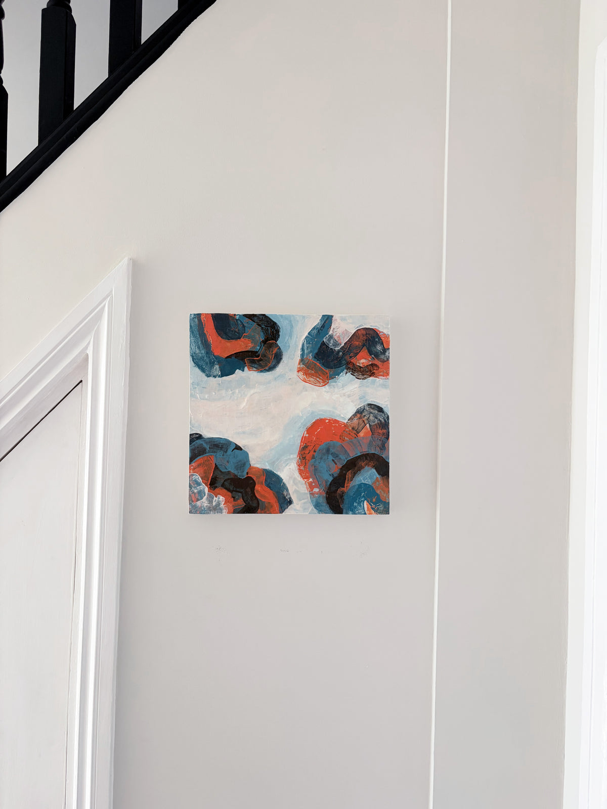 Original abstract acrylic painting "Breaking Formation" from The Sublime Horizon collection, in navy, orange and charcoal, by Rugby-based artist Olivia Miles