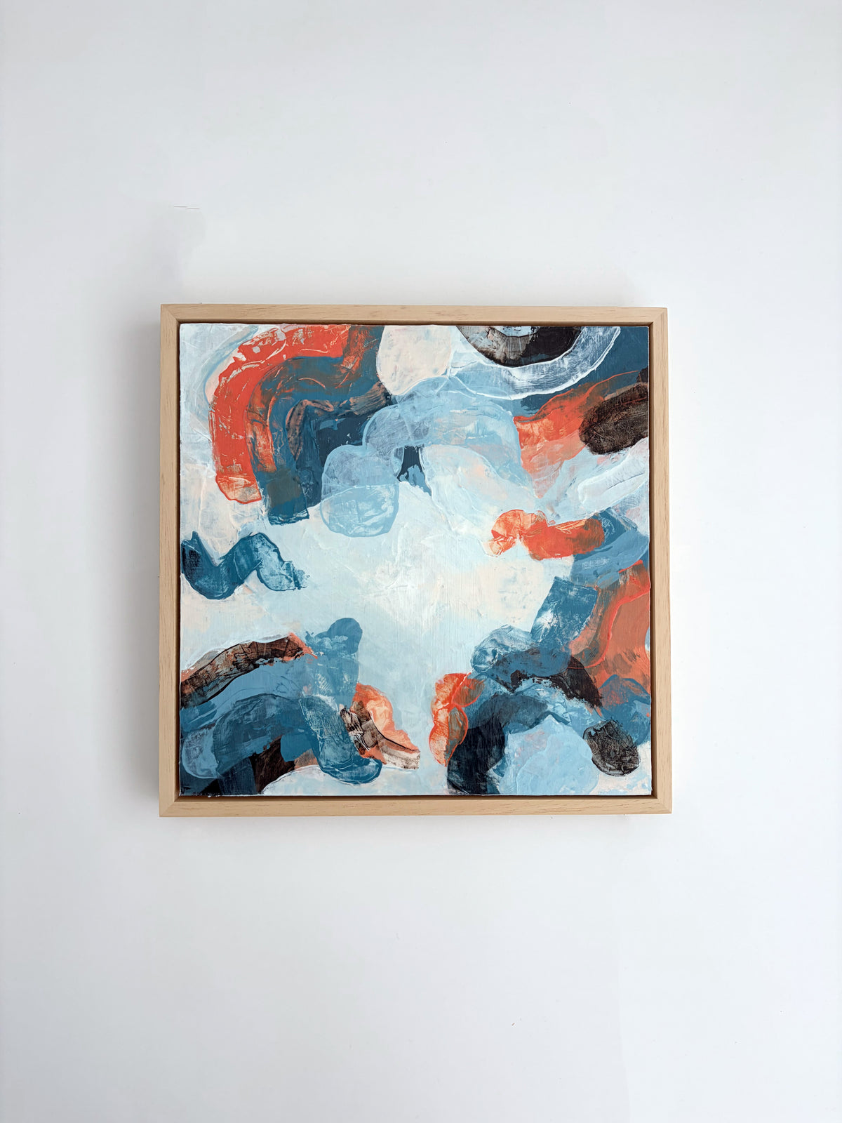 Original abstract acrylic painting "Everything, All At Once" from The Sublime Horizon collection, in pale blue, navy and burnt orange, by Rugby-based artist Olivia Miles