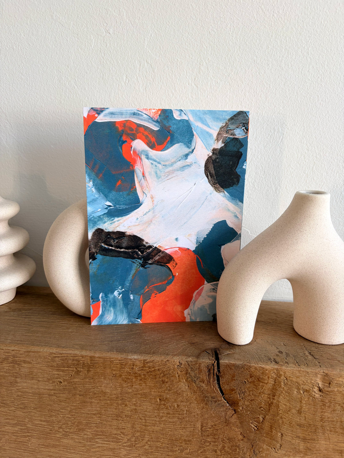 Sublime Horizon art postcard print in navy, blue, orange and white, by Rugby-based artist Olivia Miles