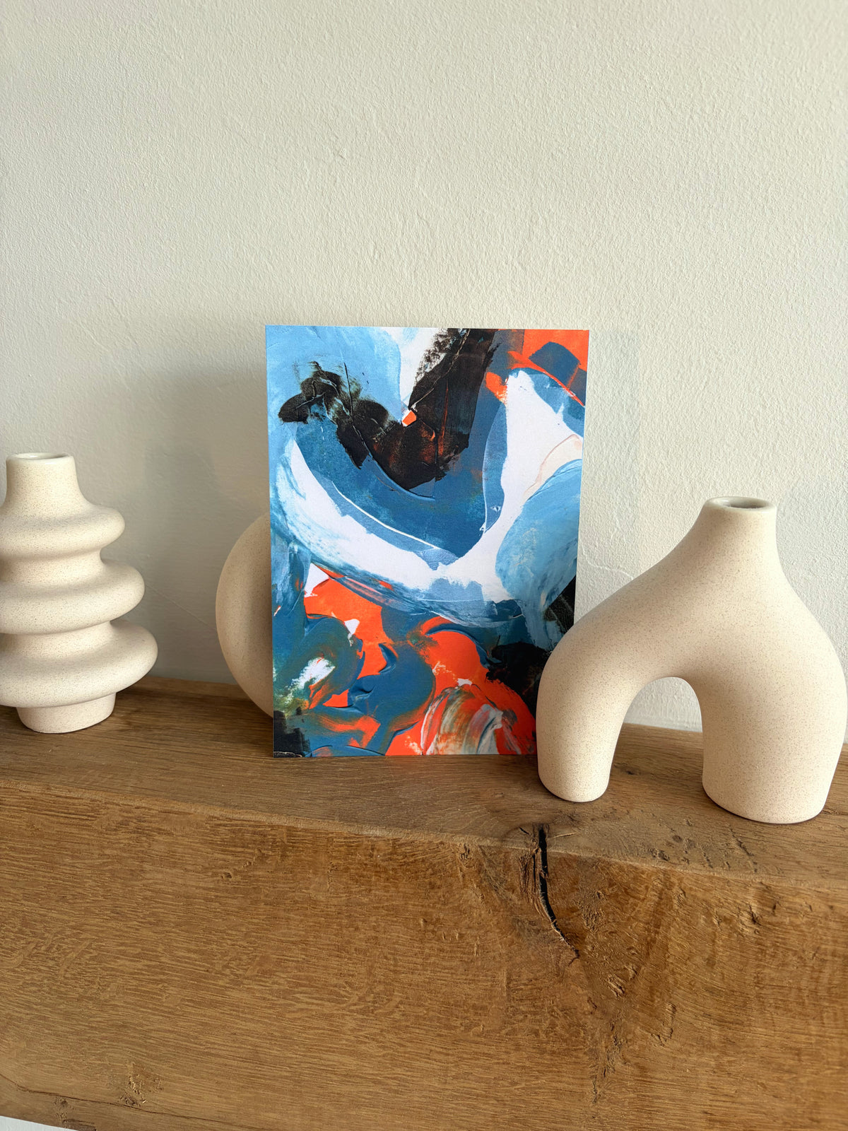 Sublime Horizon art postcard print in navy, charcoal, orange and white, by Rugby-based artist Olivia Miles