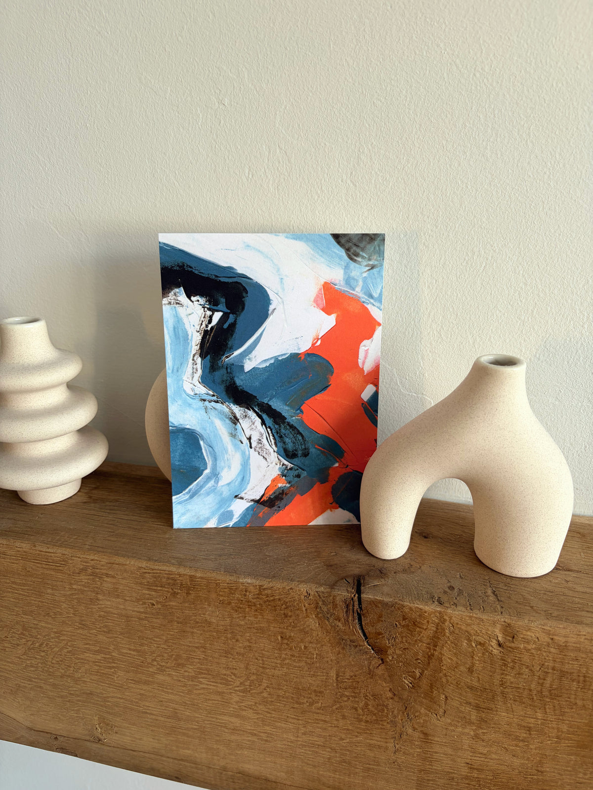 Sublime Horizon art postcard print in pale blue, white and vivid orange, by Rugby-based artist Olivia Miles