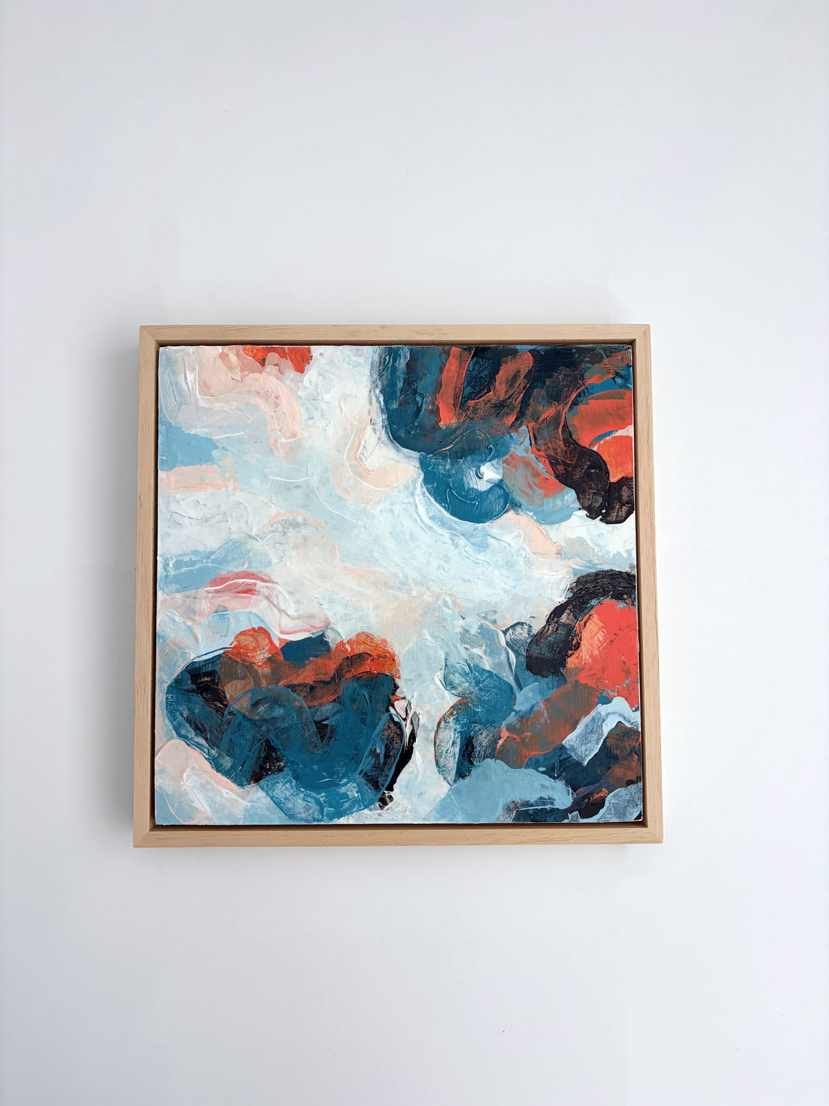 Original abstract acrylic painting "The Calm Before" from The Sublime Horizon collection, in blush pink, pale blue and navy, by Rugby-based artist Olivia Miles