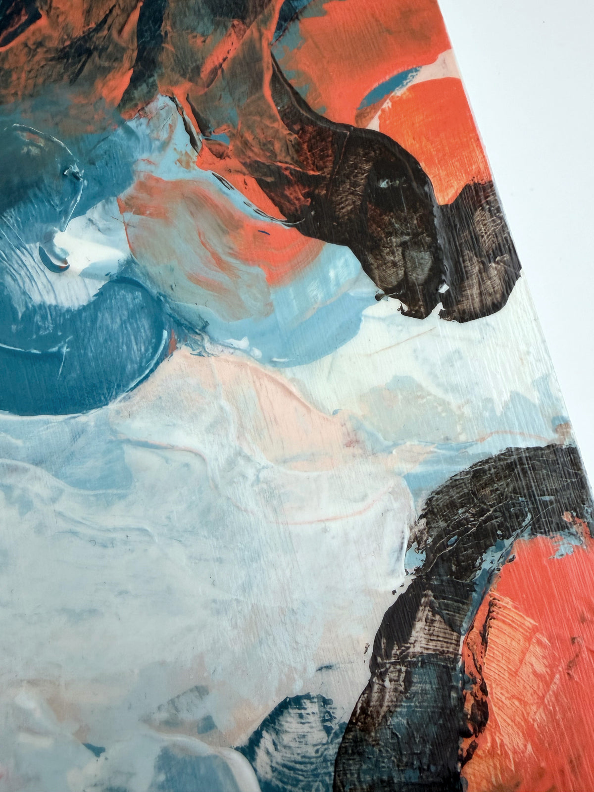 Abstract panel painting with thick impasto brushstrokes in orange, blue, dark brown, and off-white.