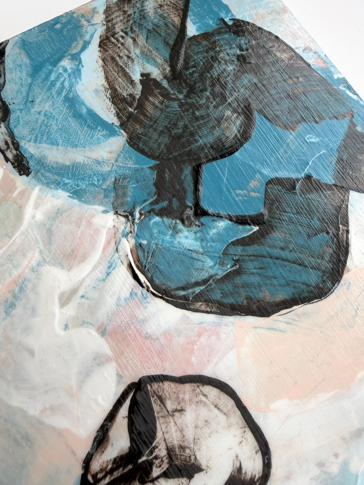 Abstract acrylic painting featuring textured blue, dark brown, white, and soft pink brushstrokes.