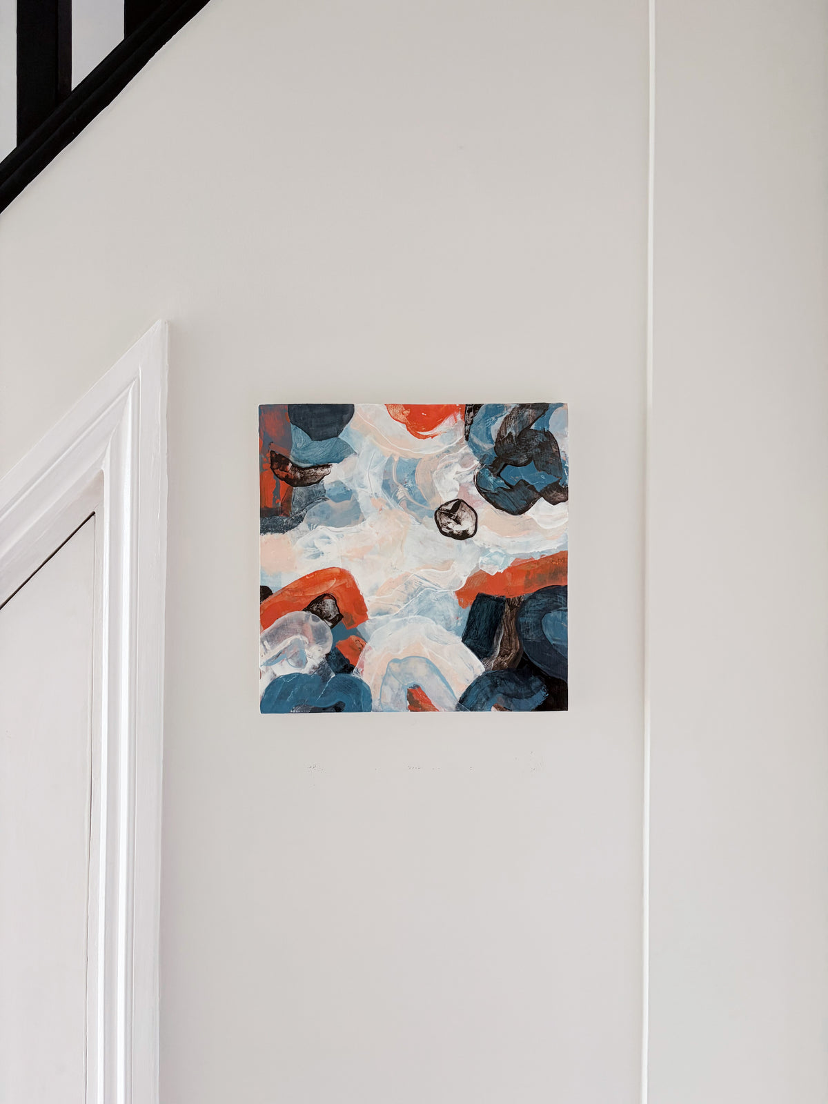 Original abstract acrylic painting "Under a Restless Sky" from The Sublime Horizon collection, in navy, charcoal and burnt orange on a pale ground, by Rugby-based artist Olivia Miles