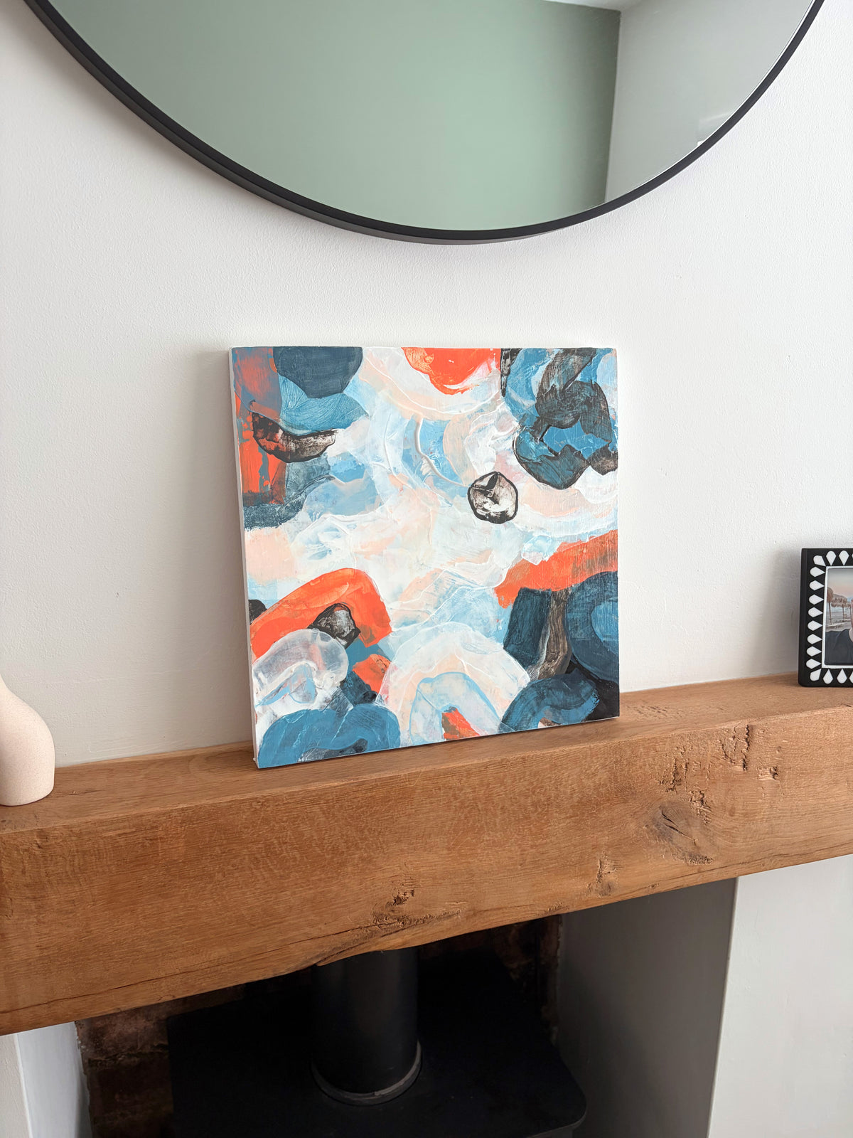 Original abstract acrylic painting "Under a Restless Sky" from The Sublime Horizon collection, in navy, charcoal and burnt orange on a pale ground, by Rugby-based artist Olivia Miles
