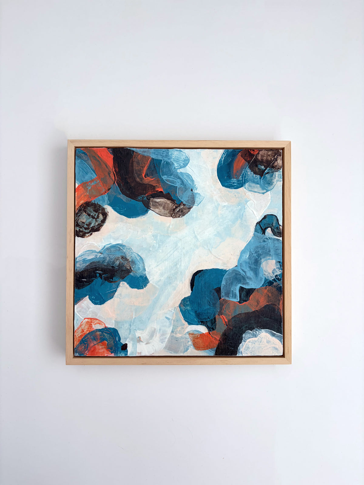 Original abstract acrylic painting "Where the Sky Splits" from The Sublime Horizon collection, in blue, charcoal and burnt orange, by Rugby-based artist Olivia Miles