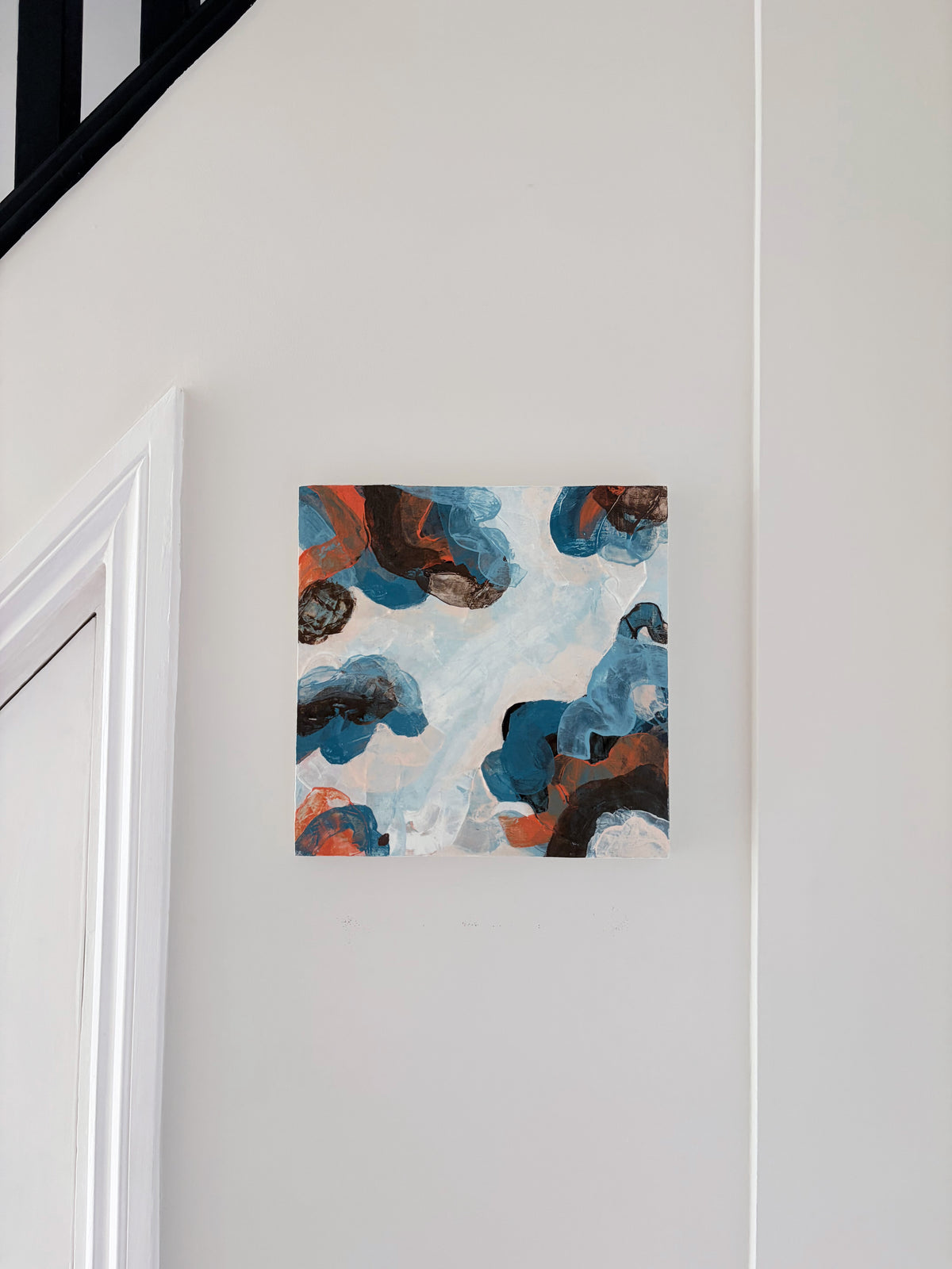 Original abstract acrylic painting "Where the Sky Splits" from The Sublime Horizon collection, in blue, charcoal and burnt orange, by Rugby-based artist Olivia Miles
